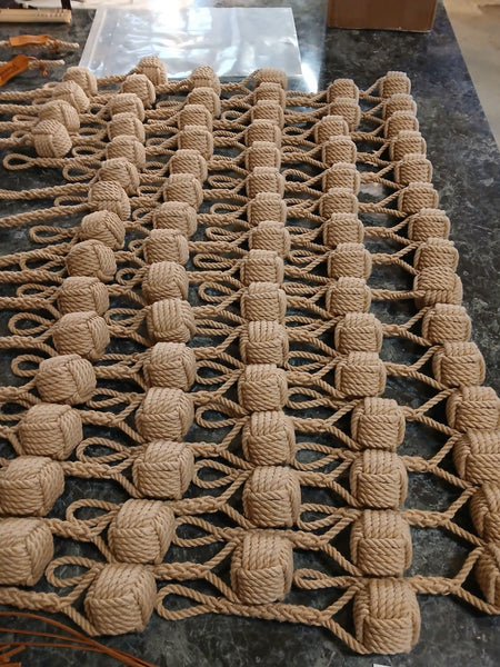 A batch of "Chunky Monkey" Heaving Line Knots - handmade at our rigging shop!